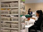 Election workers process ballots for California’s state primary election at the Los Angeles County Ballot Processing Center.