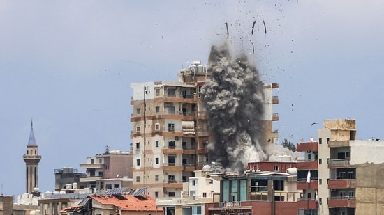 Smoke and debris rise following an Israeli airstrike in Tyre on June 9, 2026.