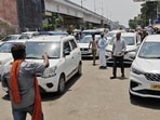 Private vehicles pick up passengers at Kamta Crossing in Lucknow on Tuesday, causing traffic congestion. (Deepak Gupta/HT)