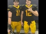 Austin Metcalf and his twin brother, Hunter, after a Memorial High School football game