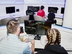 Travelers play a Nintendo Switch at the Portal Lounge in Minneapolis-St. Paul International Airport.