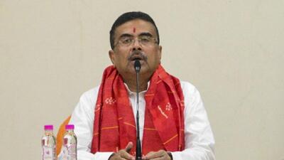Adhikari has retained several key portfolios, including home and hill affairs, personnel and administrative reforms, land and land reforms, refugee relief and rehabilitation, power, and information and cultural affairs. (PTI) Adhikari has retained several key portfolios, including home and hill affairs, personnel and administrative reforms, land and land reforms, refugee relief and rehabilitation, power, and information and cultural affairs. (PTI)