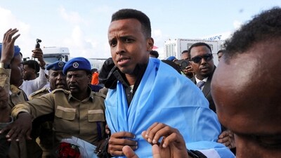 Somali referee Omar Abdulkadir Artan is received as he arrives at the Aden Abdulle Osman International Airport in Mogadishu. (REUTERS)