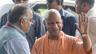 UP chief minister Yogi Adityanath, right, being received by BJP leader Tarun Chugh, on his arrival before a meeting of the ruling National Democratic Alliance (NDA) leaders in New Delhi on Wednesday. (PTI PHOTO) UP chief minister Yogi Adityanath, right, being received by BJP leader Tarun Chugh, on his arrival before a meeting of the ruling National Democratic Alliance (NDA) leaders in New Delhi on Wednesday. (PTI PHOTO)