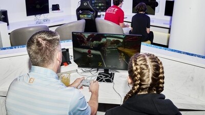 Travelers play a Nintendo Switch at the Portal Lounge in Minneapolis-St. Paul International Airport. Travelers play a Nintendo Switch at the Portal Lounge in Minneapolis-St. Paul International Airport.