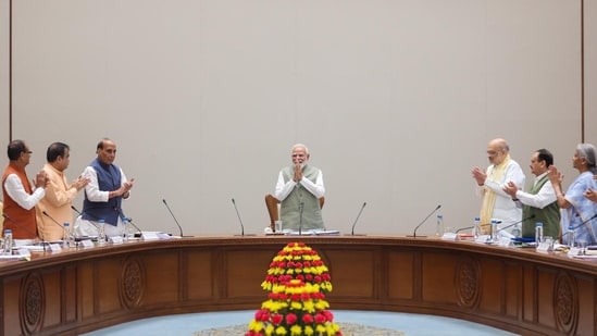 Prime Minister Narendra Modi acknowledges applause from Union Cabinet ministers. (Handout)