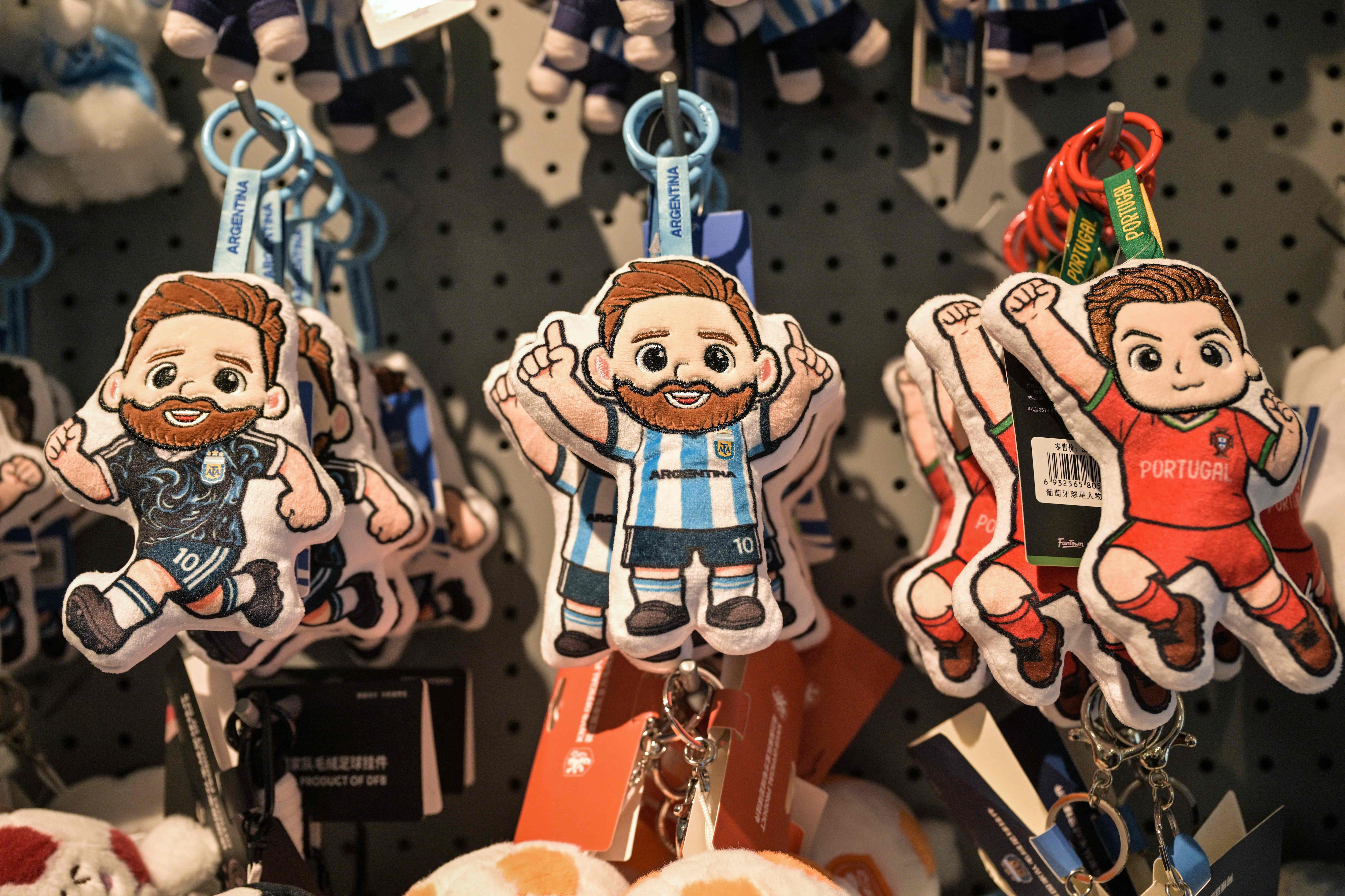 This photo taken on June 5, 2026 shows merchandise of Lionel Messi of Argentina and Cristiano Ronaldo of Portugal -- football teams that will participate in the FIFA World Cup 2026 (AFP)