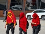 People seen covering their head and face with cloth to protect themselves from heat wave in Gurugram, India.