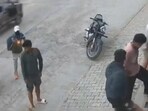 A CCTV grab of the unidentified assailant firing at the gym owner, Kapil Redhu, on a street in Hansi town on Thursday morning.