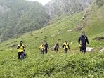 Joint team of SDRF, police and forest department searching for the missing trekker using drone camera in Valley of Flowers. (HT Photo) Joint team of SDRF, police and forest department searching for the missing trekker using drone camera in Valley of Flowers. (HT Photo)