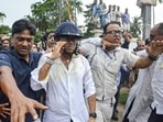 TMC general secretary Abhishek Banerjee wears a helmet after stones, shoes and eggs were hurled at him in Sonarpur on May 30