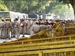 File image: Police personnel stand guard outside Union Education minister Dharmendra Pradhan's residence(PTI)