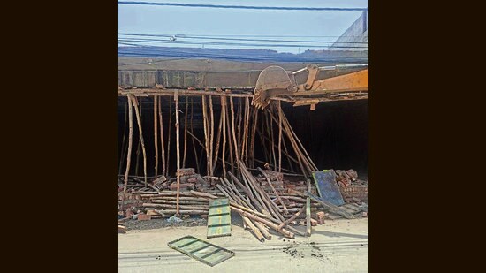 An illegal under-construction shop on Reru Sahib road being demolished on Thursday. (HT Photo)