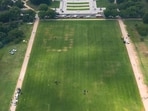 Federal authorities are investigating a large "8647" marking discovered on the National Mall in Washington, DC, ahead of the Great American State Fair. (Photo by Anna Moneymaker / Getty Images via AFP)