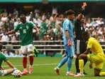 South Africa's Sphephelo Sithole is shown a red card by referee Wilton Sampaio during the opening match against Mexico. (Reuters)