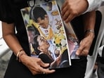 Mourners hold photos of Thai Princess Bajrakitiyabha Mahidol and her father Thai King Maha Vajiralongkorn inside Chulalongkorn Hospital in Bangkok on June 12, 2026. Thai Princess Bajrakitiyabha Mahidol, the king's eldest daughter, has died aged 47, the royal palace announced on June 12, more than three years after she was hospitalised following a sudden illness. (Photo by Lillian SUWANRUMPHA / AFP)
