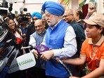 Union petroleum minister Hardeep Singh Puri fills E85 fuel in a car in New Delhi. (ANI)