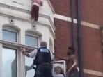 East London man catches child from second-floor window ledge.