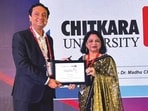 Vaibhav Srivastava, India Head–EdTechs & Education, Google Cloud, presents a plaque to Madhu Chitkara at the launch of Digital Campus on Google Cloud 4.0. (HT Photo)