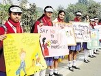 School students take part in the human chain to spread awareness against dowry and child marriage.(HT Photo)