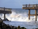 Sea waves lash near a broken bridge in Thiruvananthapuram after the southwest monsoon sets over Kerala on June 4