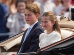 Princess Charlotte and Prince George and  ride on an open top carriage during Trooping The Colour, the King's annual birthday parade, in London, Saturday, June 13, 2026. (AP Photo/Kirsty Wigglesworth)