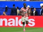 Folarin Balogun celebrates scoring his team's second goal during the 2026 World Cup Group D football match between USA and Paraguay. 