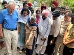Punjab health minister Dr Balbir Singh inspecting a water pipeline leakage in Patiala on Friday. (HT)