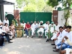 RJD workers stand guard at the entrance of the residence of RJD leaders Lalu Prasad Yadav and Rabri Devi after the Government of Bihar withdraw their Z-plus security cover following a review of the VIP security arrangements in the state last week. (Santosh Kumar/HT)
