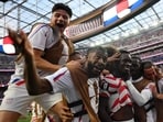 US forward Folarin Balogun celebrates with teamamtes after scoring his team's third goal in the 2026 World Cup Group D match against Paraguay at the Los Angeles Stadium in Inglewood on Friday. (AFP)