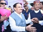 Union health minister JP Nadda greet party workers on his arrival at Peterhoff for the event ‘Viksit Bharat Sankalp Sammelan’, Shimla on Friday. (Deepak Sansta/ HT)