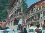 Tourists seen hanging out of a moving car in Kasol. Tourists seen hanging out of a moving car in Kasol.
