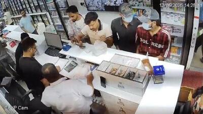 A CCTV grab of the two masked assailants before one of them pulled out a gun to shoot at the cashier, Janki Das (in white shirt), at Sree Kumar Medicos in the busy Sector 11 market in Chandigarh on Saturday afternoon.