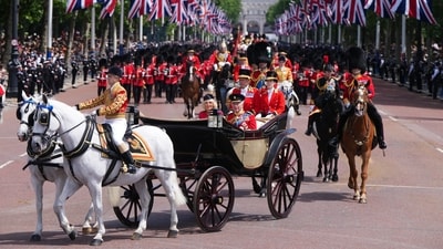 Britain's King CharlesII and Queen Camilla travel in an open carriage as they return to Buckingham Palace during Trooping The Colour, the King's annual birthday parade, in London, Saturday, June 13, 2026. (AP Photo/Kirsty Wigglesworth) (AP Photo/Kirsty Wigglesworth)