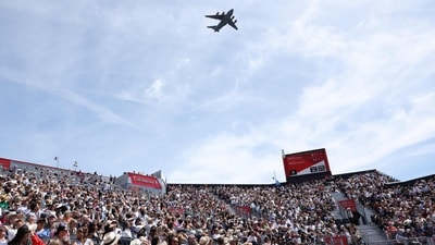 A plane part of the flypast for the King's Birthday Parade "Trooping the Colour" interrupts play during the women's singles semi-final tennis match at the HSBC WTA Championships at Queen's Club in west London on June 13, 2026. (Photo by Adrian Dennis / AFP) (AFP)