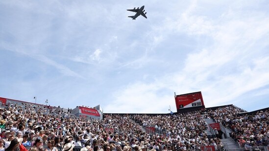 A plane part of the flypast for the King's Birthday Parade "Trooping the Colour" interrupts play during the women's singles semi-final tennis match at the HSBC WTA Championships at Queen's Club in west London on June 13, 2026. (Photo by Adrian Dennis / AFP)(AFP)