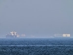 FILE: A tanker, left, and a car carrier are anchored at sea in the Gulf of Oman near the Strait of Hormuz, as seen from the coast near Khor Fakkan, United Arab Emirates. (AP/PTI)