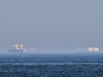 FILE: A tanker, left, and a car carrier are anchored at sea in the Gulf of Oman near the Strait of Hormuz, as seen from the coast near Khor Fakkan, United Arab Emirates. (AP/PTI)