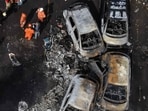An aerial view shows firefighters working at the site of a helicopter crash in the Recreio dos Bandeirantes neighbourhood in Rio de Janeiro, Brazil, on June 14, 2026.