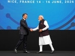 France's President Emmanuel Macron shakes hands with India's Prime Minister Narendra Modi on stage during the "Bharat Innovate 2026" event in Nice south-eastern France. (Photo by Lewis JOLY / POOL / AFP)