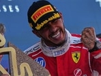 Ferrari driver Lewis Hamilton celebrates after winning the Grand Prix in Barcelona. (AP)