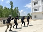 Jammu and Kashmir policemen during a mock drill as part of the upcoming Amarnath Yatra security measures, in Srinagar on Sunday. (ANI)