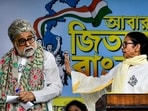 Former West Bengal CM and TMC supremo Mamata Banerjee with party MP Sudip Bandyopadhyay during an election campaign, in Kolkata.