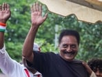 Actor Prakash Raj greets the gathering during a protest by Cockroach Janta Party (CJP) demanding the resignation of Union Education Minister Dharmendra Pradhan over the NEET paper leak and irregularities related to CBSE's on-screen marking system, at Freedom Park, in Bengaluru.