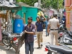 Residents of the JJ cluster near Jaipur Polo ground shift their household belongings on Sunday. (Vipin Kumar/Hindustan Times)