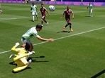 Qatar's Mahmoud Abunada fouls Switzerland's Remo Freuler to concede a penalty.