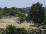 The excavation site near the Indira Canal in Lucknow that is under investigation for alleged illegal soil mining. (Deepak Gupta/HT)