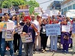 The protesters outside the residence of MLA Kulwant Singh Sidhu in Ludhiana on Sunday. (Gurpreet Singh/HT)