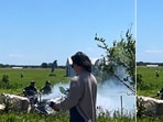 Visuals have emerged from the crash site showing the downed aircraft engulfed in smoke as it lay in a field near Butler Memorial Airport in Missouri, where a plane carrying skydivers crashed on Sunday, killing all 12 people on board, authorities said.