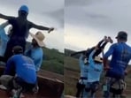 Videos taken from various angles and posted on X show the crew calmly carrying the woman to the edge of the Skeleton Bridge.